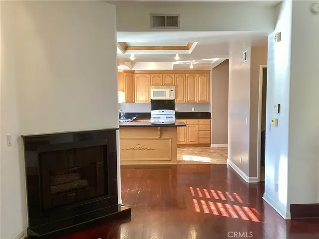 a kitchen with cabinets appliances and a window