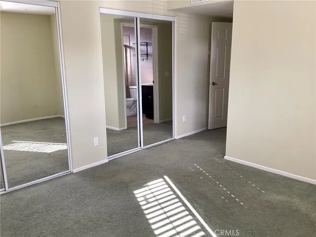 a white toilet and tub next to a bathroom sink