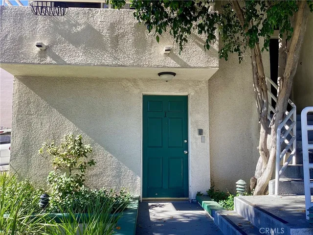 a view of backyard and garage