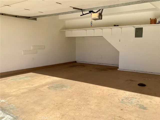 a view of a hallway with wooden floor and a fireplace