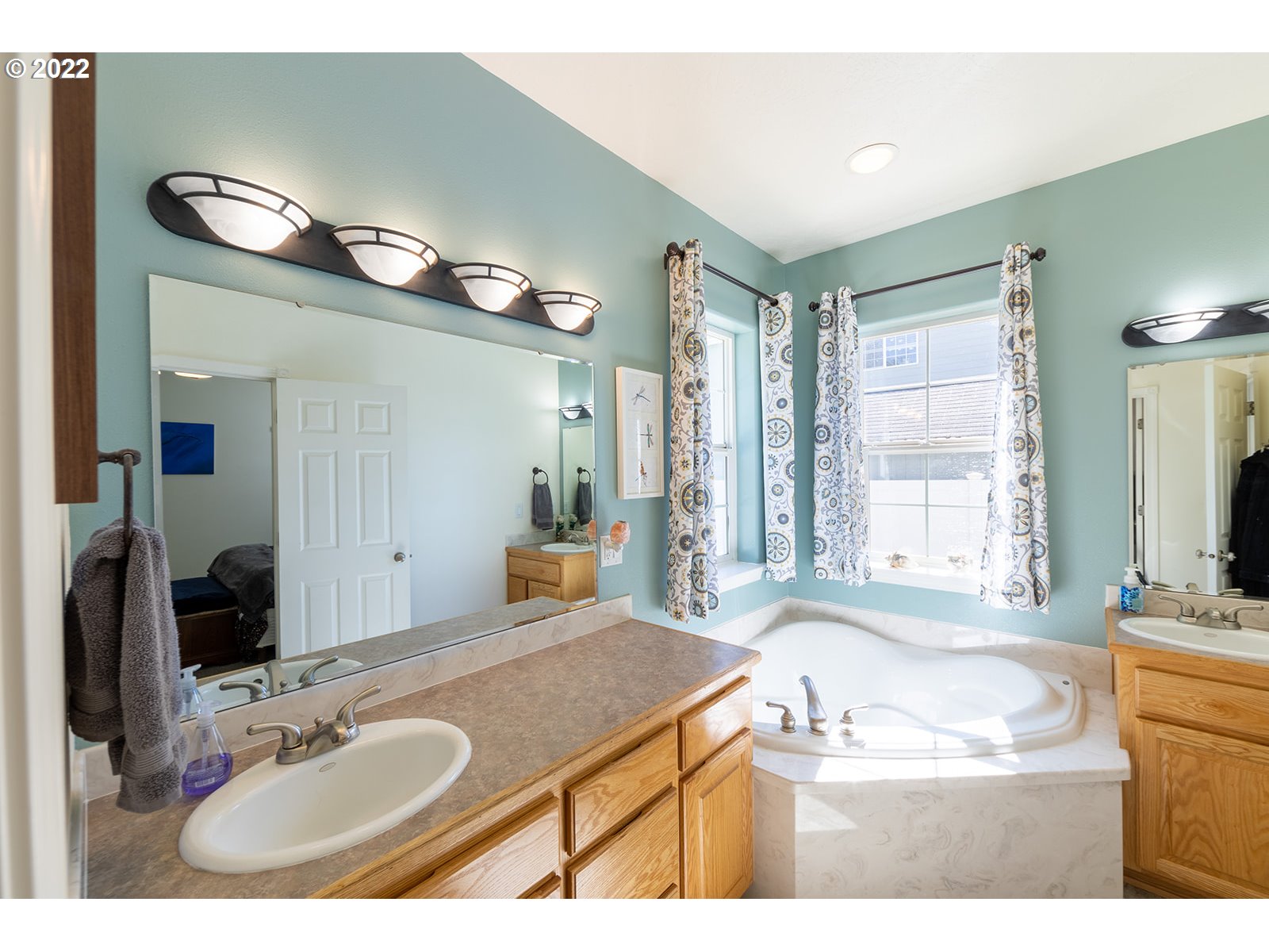 7193 F Place Springfield, OR 97478 - Photo 16 of 32 a bathroom with a granite countertop sink and a mirror