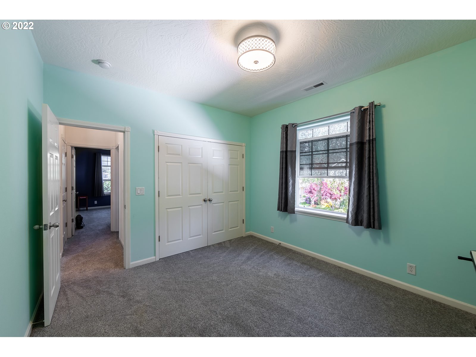 7193 F Place Springfield, OR 97478 - Photo 23 of 32 a view of an empty room with window and fireplace