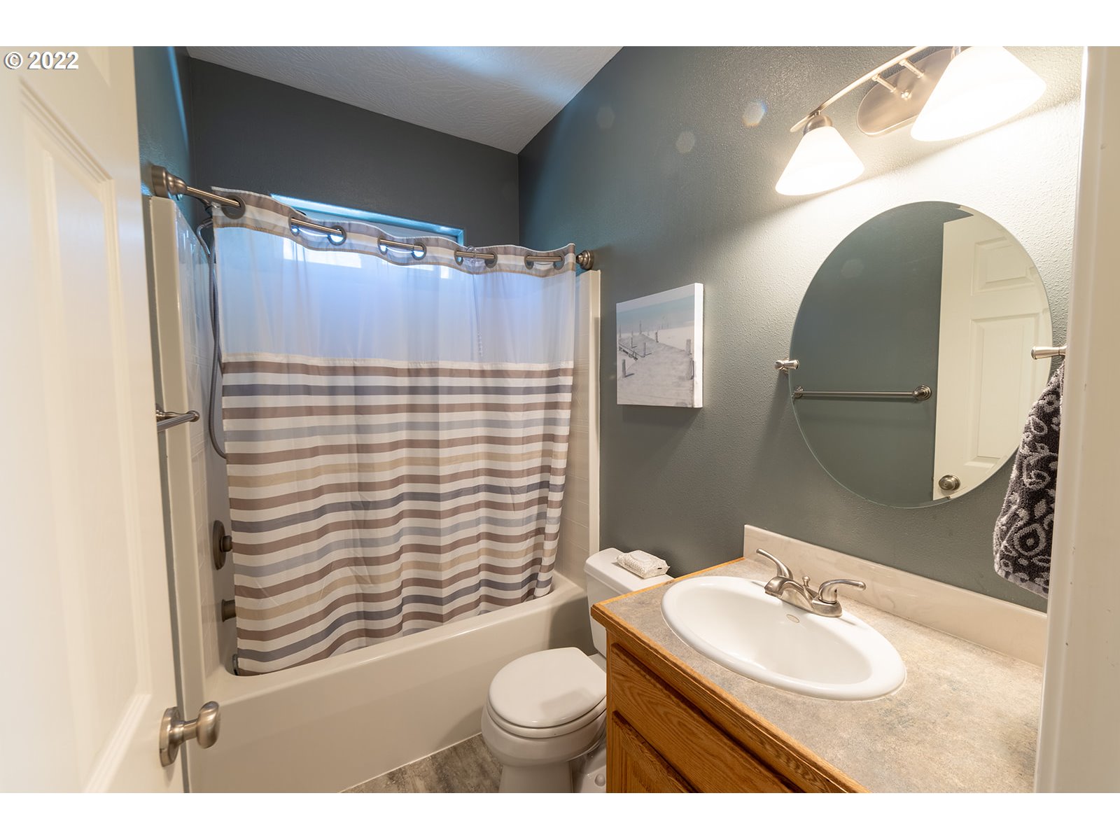 7193 F Place Springfield, OR 97478 - Photo 24 of 32 a bathroom with a sink toilet and shower