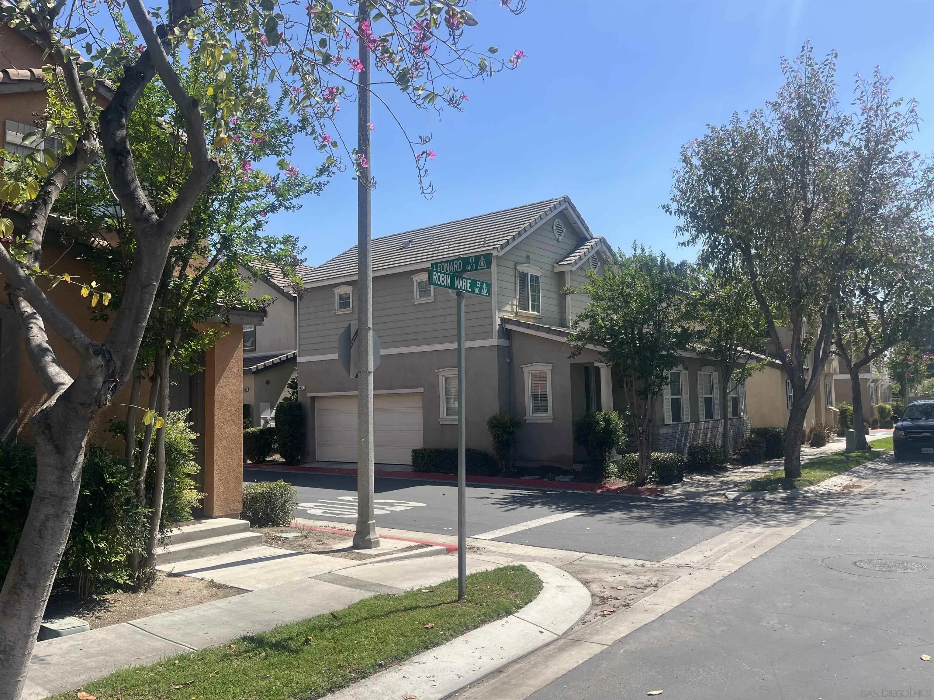 4437 Leonard Court Riverside, CA 92501 - Photo 3 of 6 a front view of a house with street