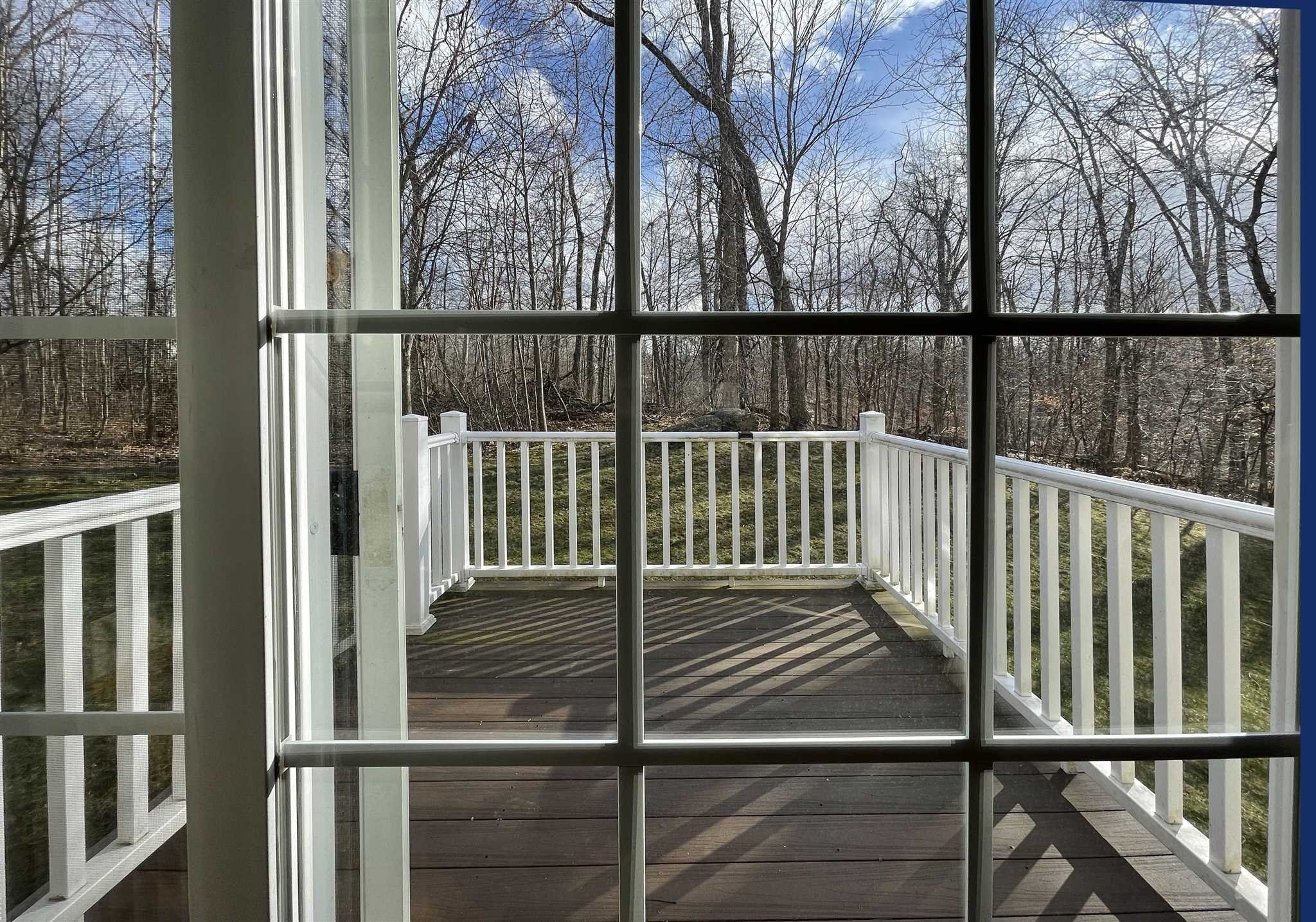 208 Pondview Loop Wappingers Falls, NY 12590 - Photo 3 of 12 a view of a balcony with wooden floor