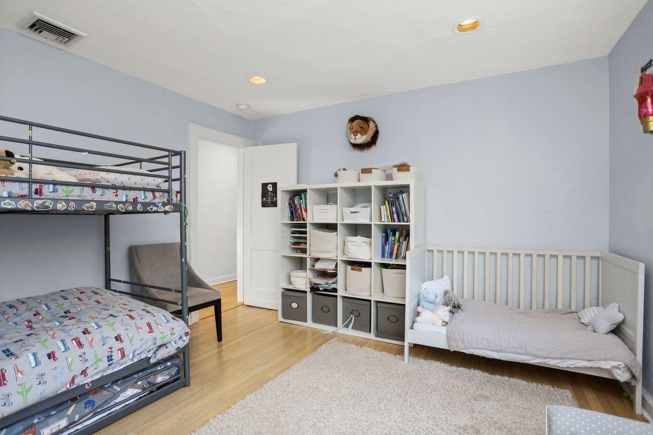 55 Oval Avenue Riverside, CT 06878 - Photo 17 of 29 a bedroom with a bed and cabinets