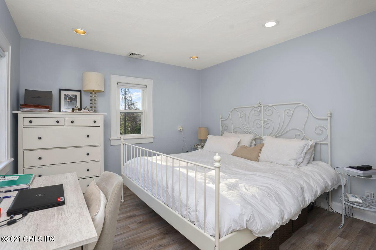 55 Oval Avenue Riverside, CT 06878 - Photo 19 of 29 a bedroom with a bed and a television