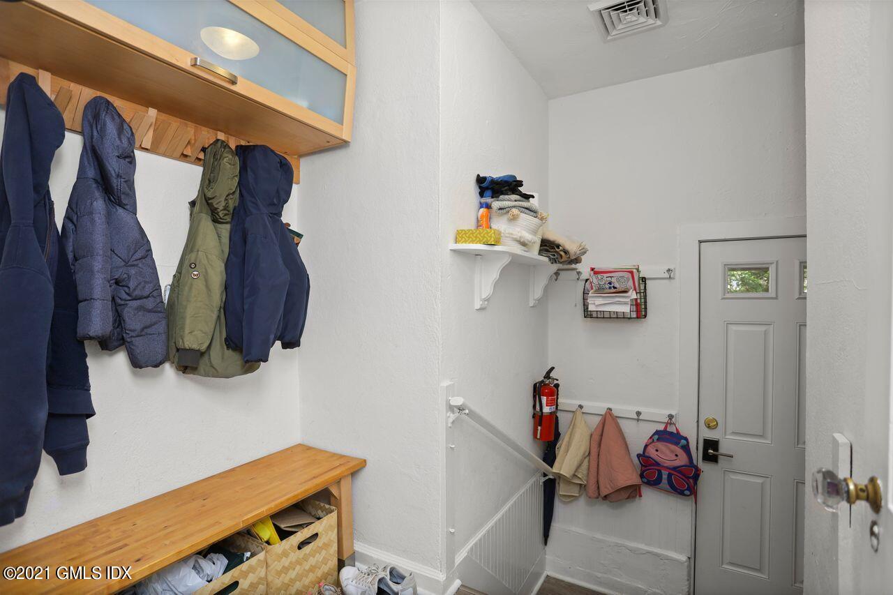 55 Oval Avenue Riverside, CT 06878 - Photo 22 of 29 a view of walk in closet with clothes and shoes