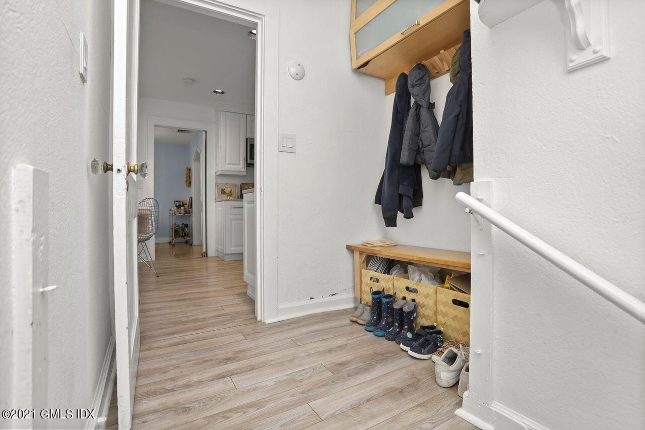 55 Oval Avenue Riverside, CT 06878 - Photo 23 of 29 a hallway with front door wooden floor