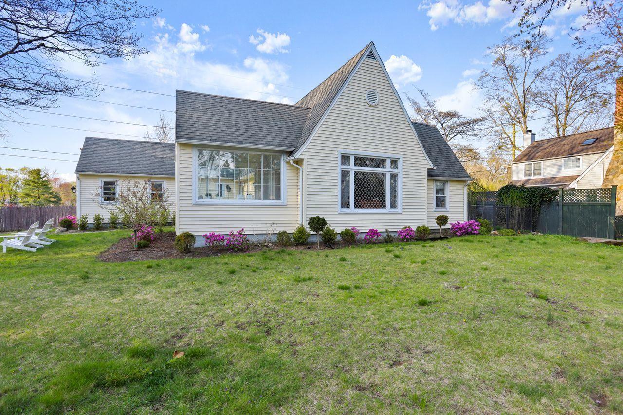55 Oval Avenue Riverside, CT 06878 - Photo 25 of 29 a front view of house with yard and green space