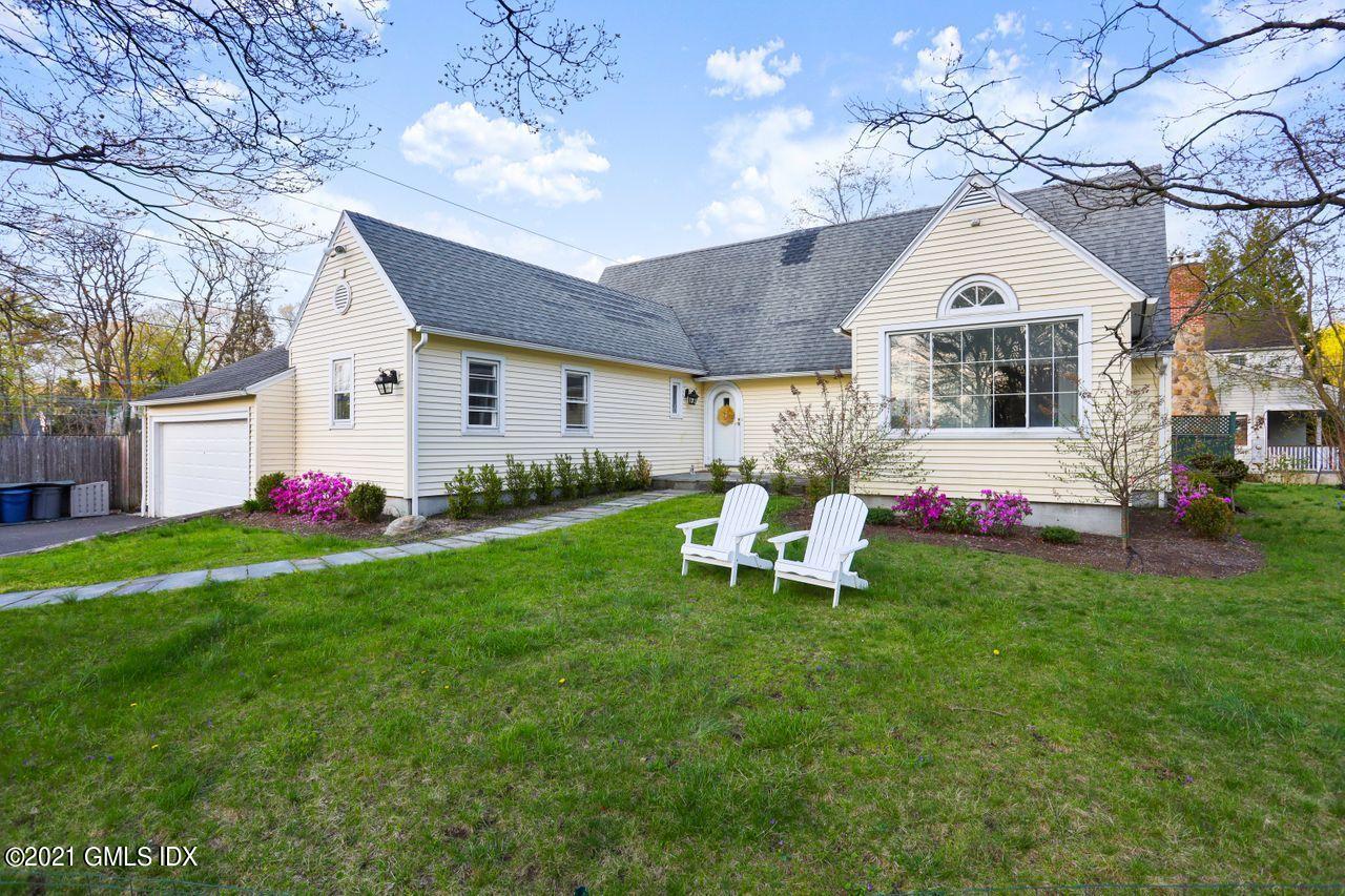 55 Oval Avenue Riverside, CT 06878 - Photo 26 of 29 a living room with furniture and a large window