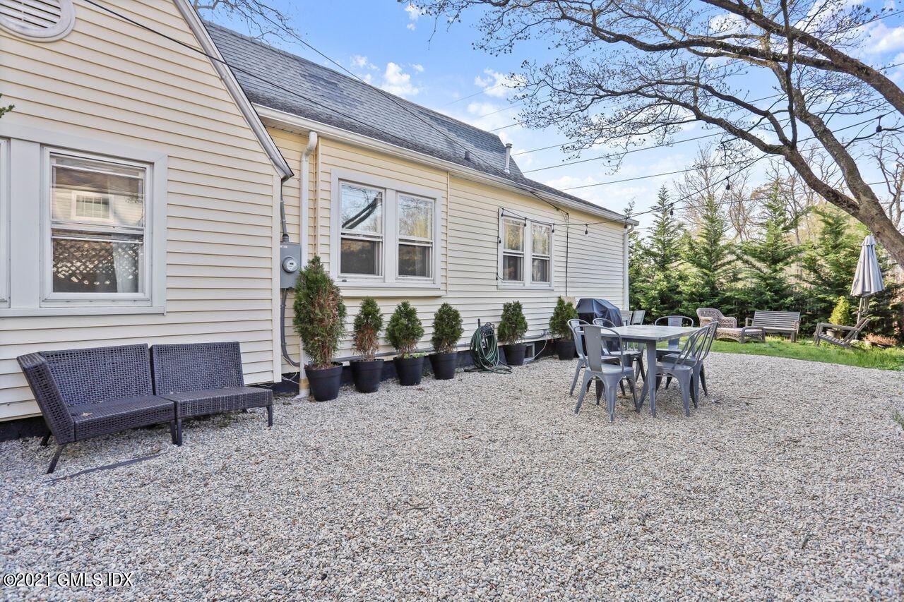 55 Oval Avenue Riverside, CT 06878 - Photo 27 of 29 a view of a house with a backyard and sitting area