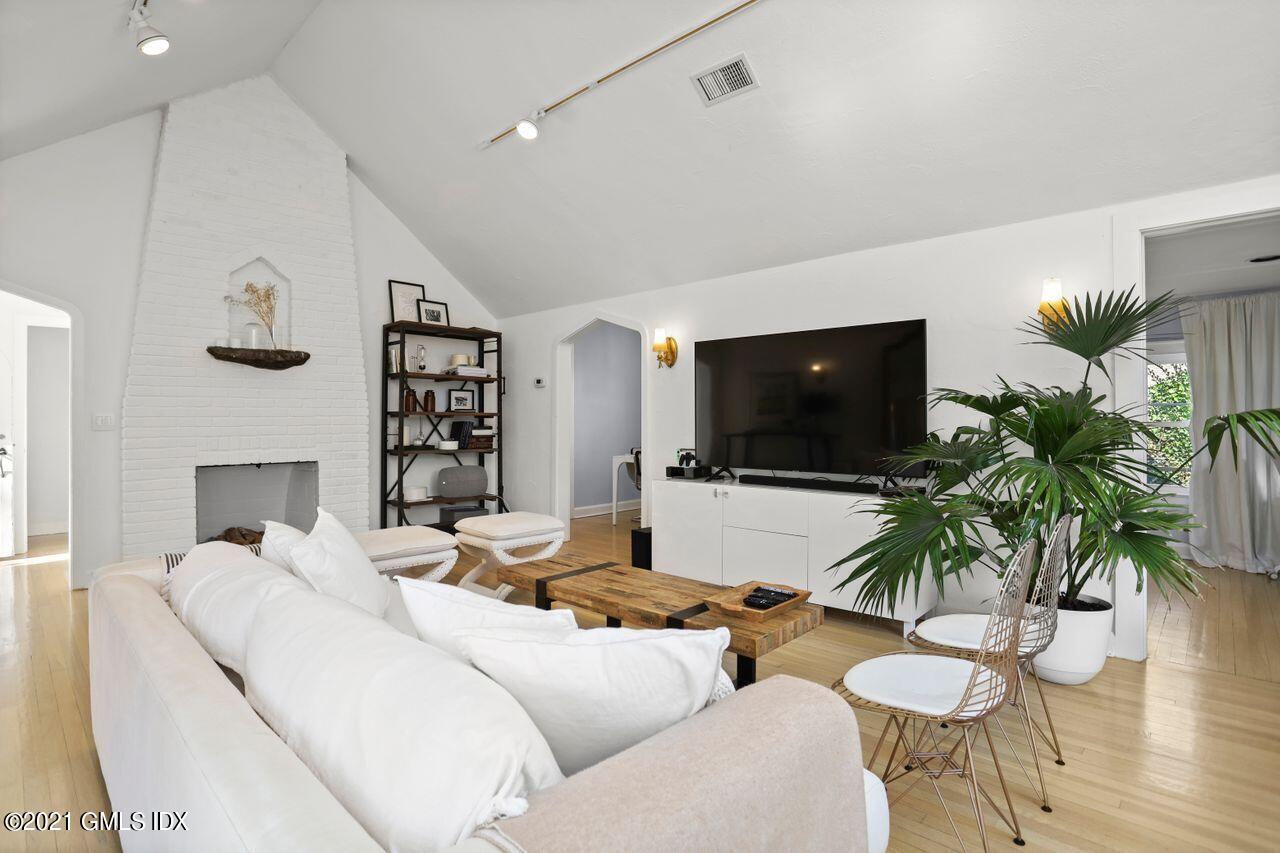 55 Oval Avenue Riverside, CT 06878 - Photo 6 of 29 a living room with furniture and a flat screen tv