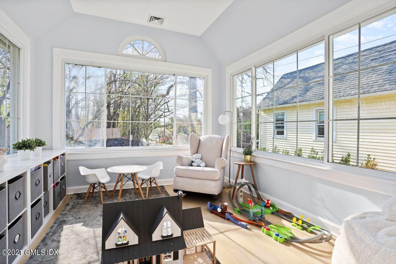 55 Oval Avenue Riverside, CT 06878 - Photo 8 of 29 a living room with furniture and a large window