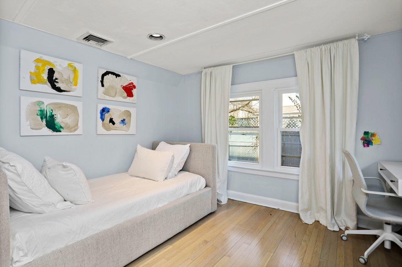 55 Oval Avenue Riverside, CT 06878 - Photo 9 of 29 a bedroom with a bed and a window