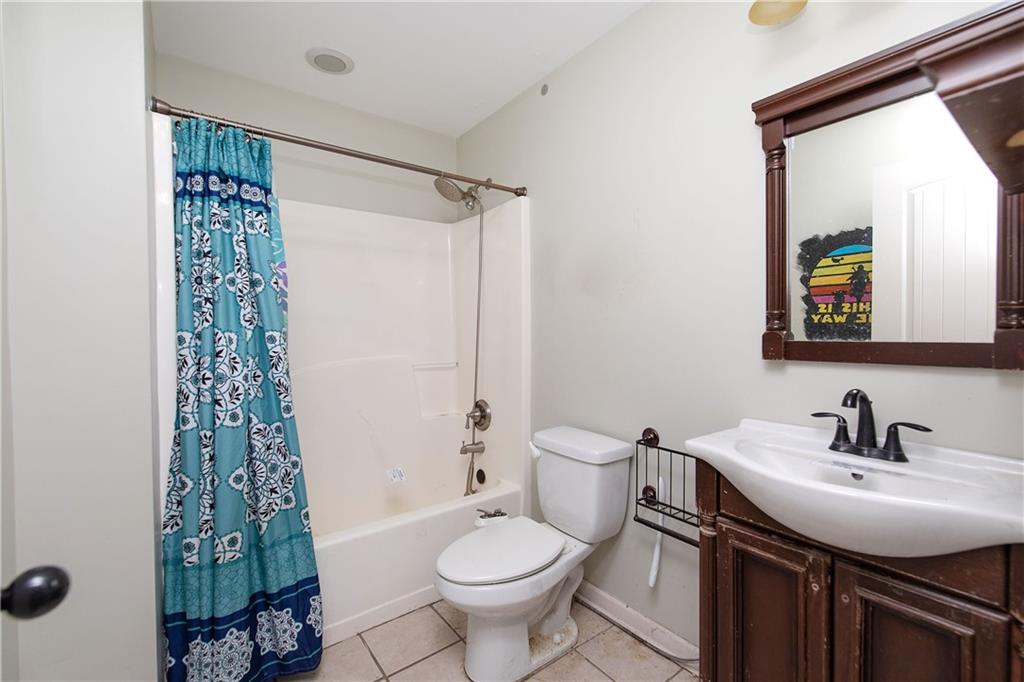 561 Holland Road Dallas, GA 30157 - Photo 29 of 48 a bathroom with a sink toilet and shower