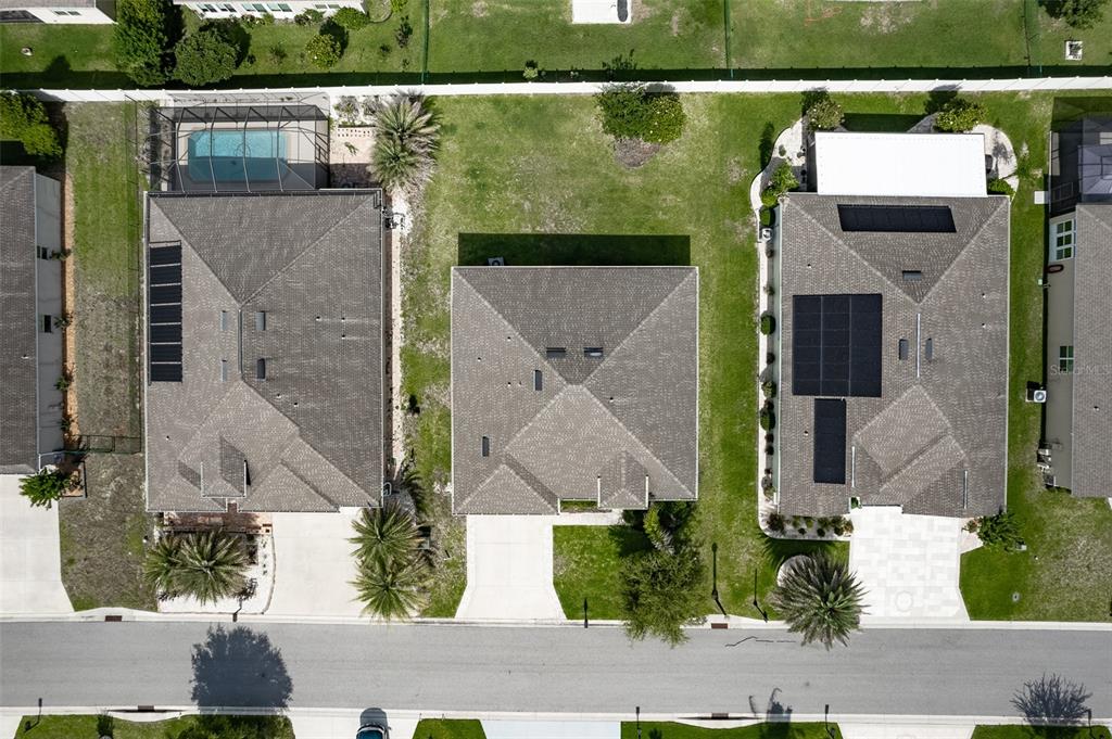 9224 Southwest 60th Ct Road Ocala, FL 34476 - Photo 48 of 55 an aerial view of a house with a garden and lake view