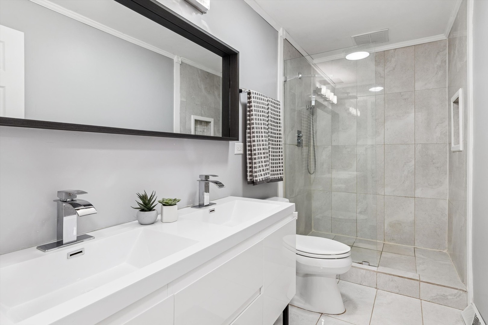 24331 Davids Court Naperville, IL 60564 - Photo 11 of 24 a bathroom with a sink a toilet and shower