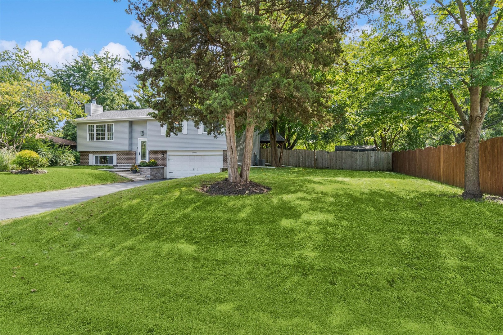 24331 Davids Court Naperville, IL 60564 - Photo 21 of 24 a view of a house with a yard and tree