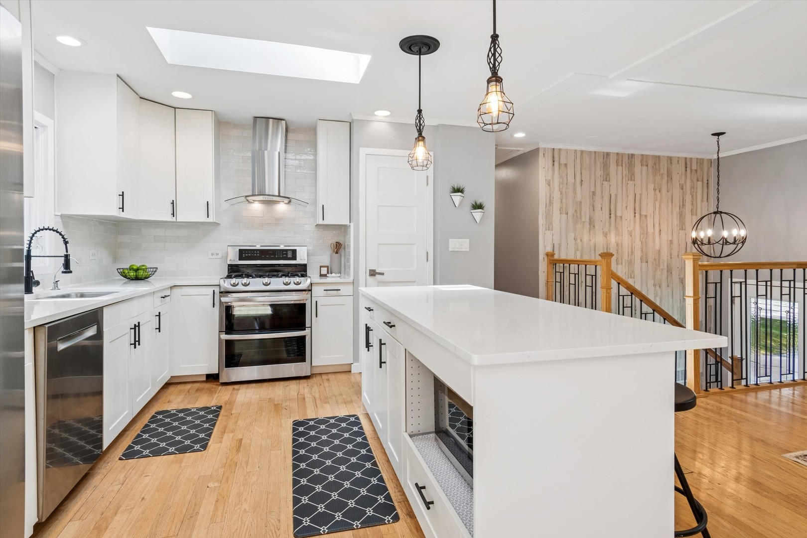 24331 Davids Court Naperville, IL 60564 - Photo 6 of 24 a kitchen that has a lot of white cabinets and stainless steel appliances