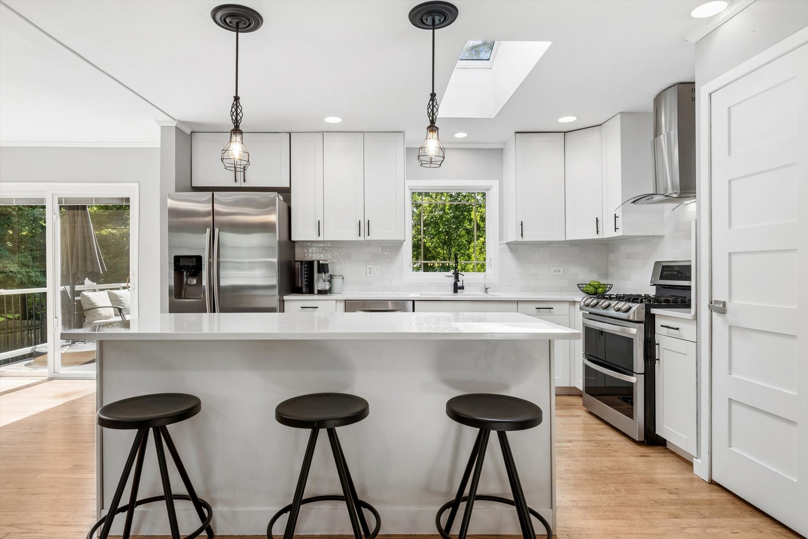 24331 Davids Court Naperville, IL 60564 - Photo 7 of 24 a kitchen with stainless steel appliances a stove a sink refrigerator and cabinets