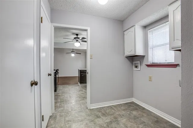 a view of a hallway with closet and wooden floor