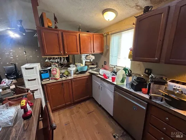 a kitchen with a refrigerator and sink