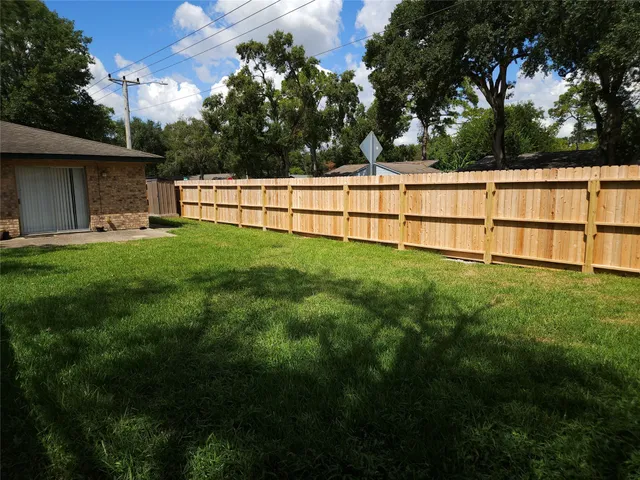 a view of backyard with green space