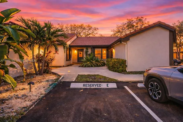 a car parked in front of a house