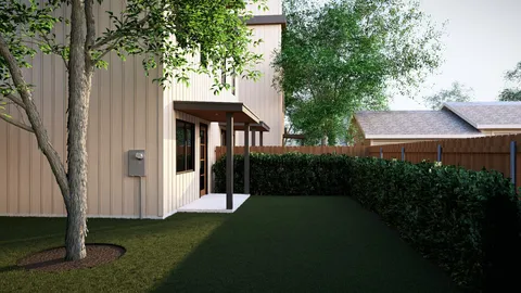 a view of a porch with furniture and garden