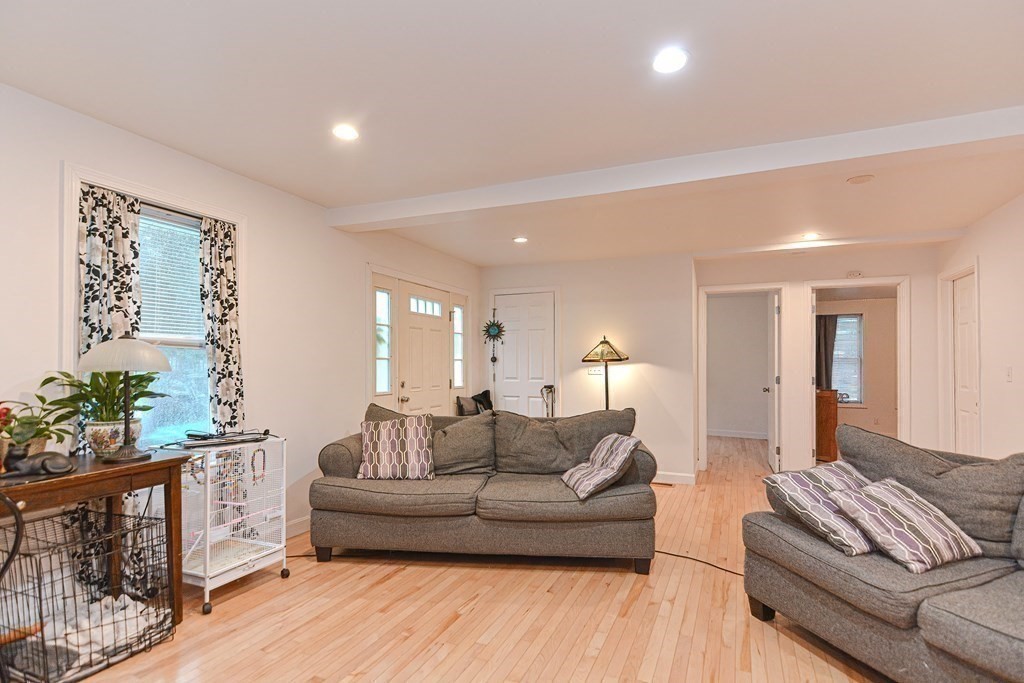 89 Broad Street, Unit 1 Lynn, MA 01902 - Photo 13 of 23 a living room with furniture and a couch