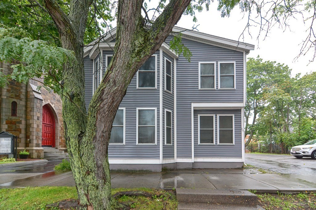 89 Broad Street, Unit 1 Lynn, MA 01902 - Photo 23 of 23 a view of a house with a yard