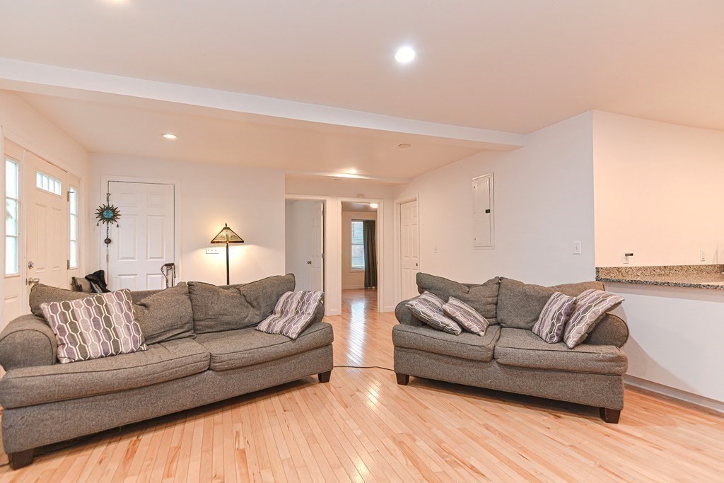 89 Broad Street, Unit 1 Lynn, MA 01902 - Photo 9 of 23 a living room with furniture and a couch