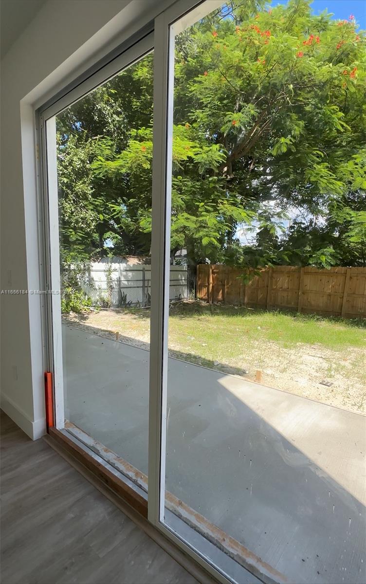 2933 Northwest 57th Street, Unit 2933 Miami, FL 33142 - Photo 14 of 14 a view of swimming pool from a window