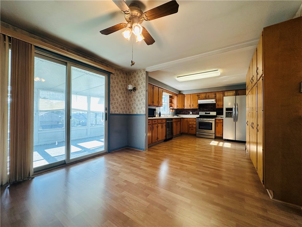 55 Wegman Street Sennett, NY 13021 - Photo 11 of 45 The large eat in kitchen has a sliding door to the