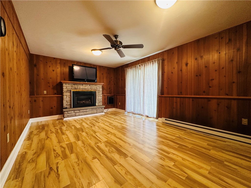 55 Wegman Street Sennett, NY 13021 - Photo 26 of 45 The first floor living room with sliding doors lea