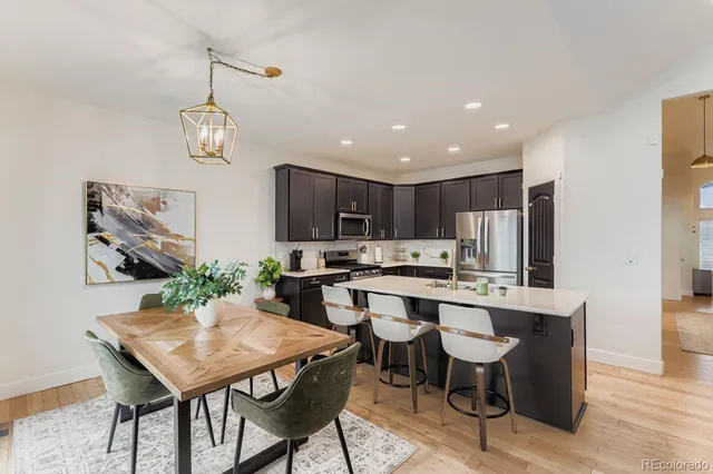 a kitchen with a table and chairs in it