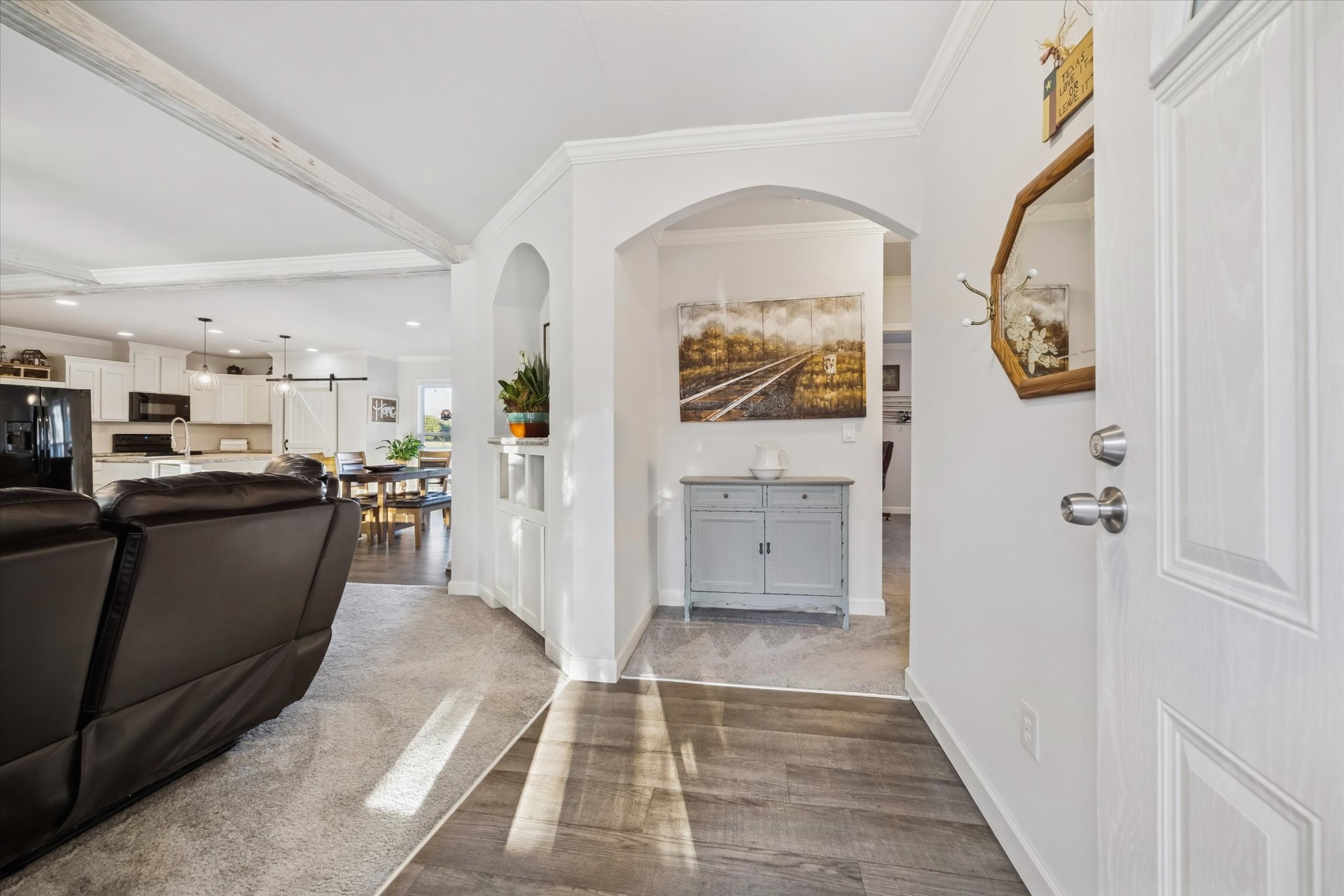 8850 Katy Hockley Road Katy, TX 77493 - Photo 11 of 37 a view of a hallway with wooden floor and furniture