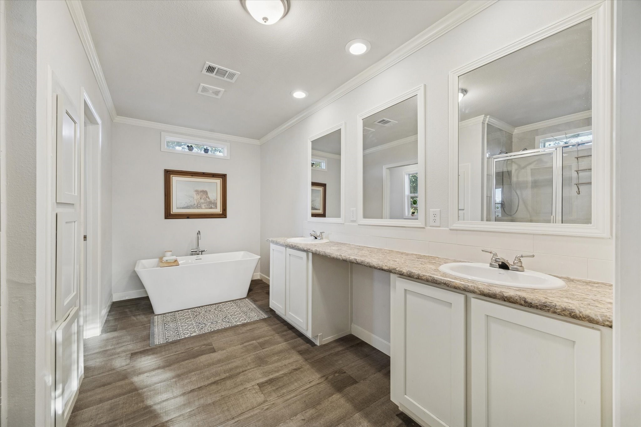 8850 Katy Hockley Road Katy, TX 77493 - Photo 22 of 37 a spacious bathroom with a granite countertop sink mirror and bathtub
