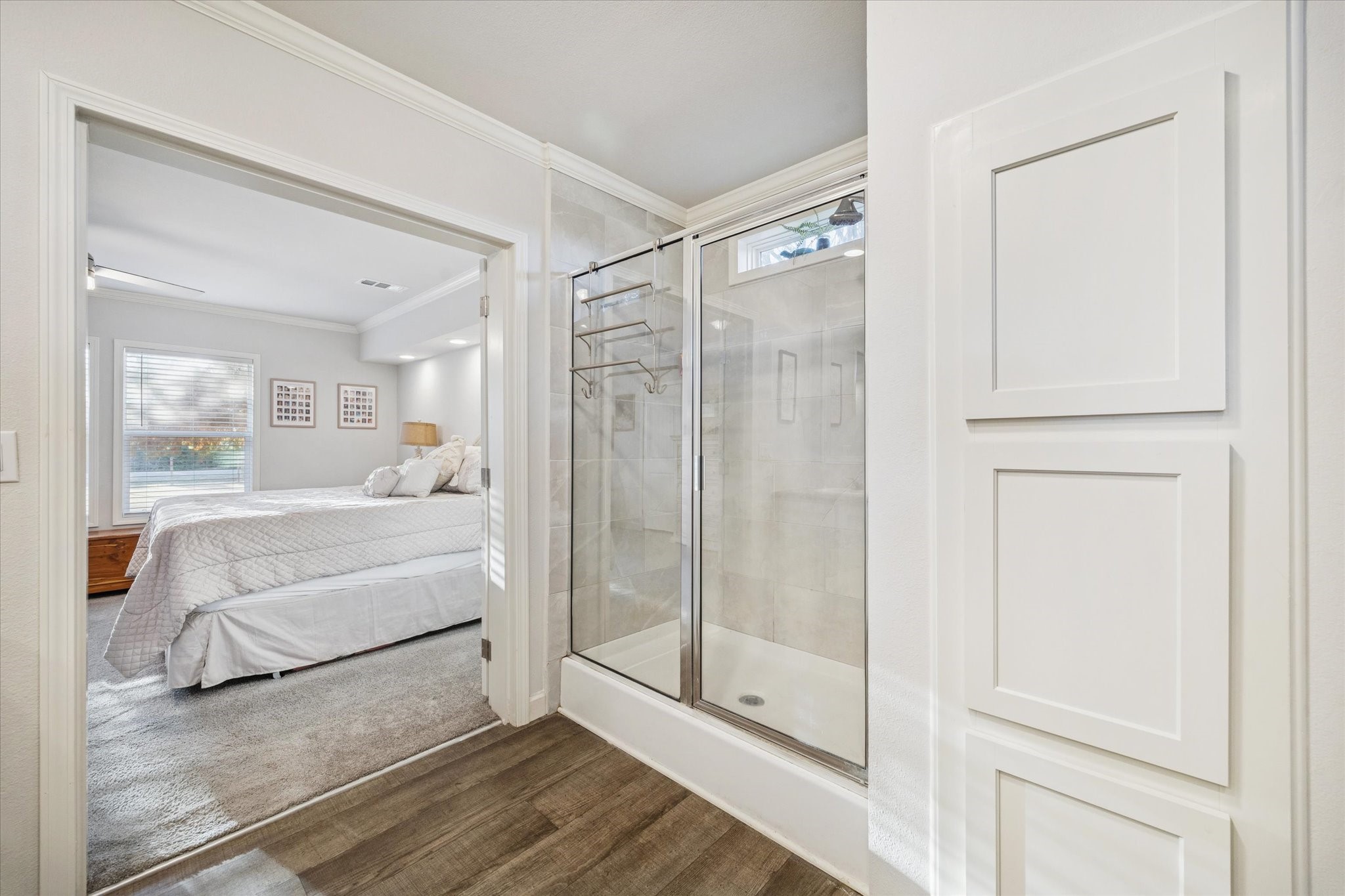 8850 Katy Hockley Road Katy, TX 77493 - Photo 23 of 37 a bathroom with a glass shower door and a bathtub