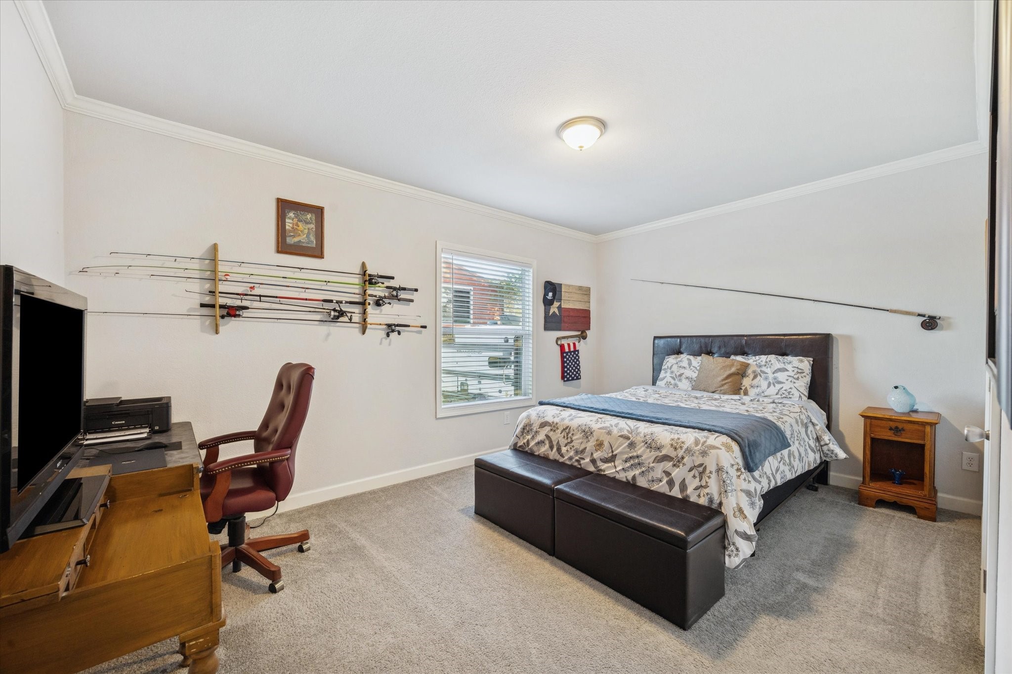 8850 Katy Hockley Road Katy, TX 77493 - Photo 25 of 37 a bedroom with a bed a desk and chair