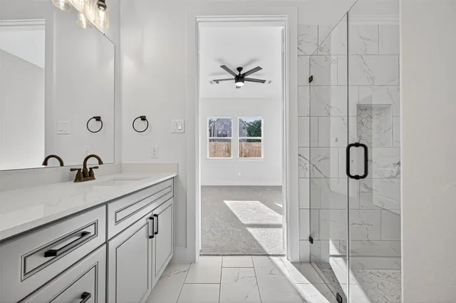 a bathroom with a sink double vanity and a mirror