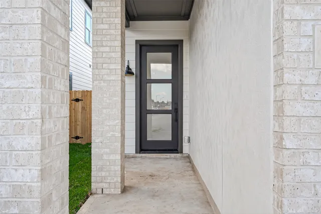 a view of a front door of a house with a porch