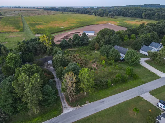 a view of a lake with a yard