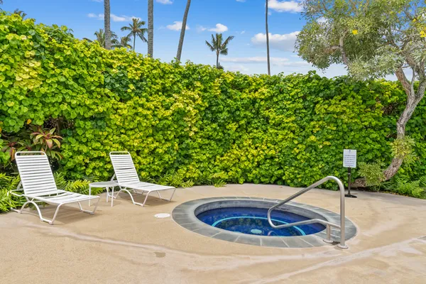 a view of a swimming pool with a yard