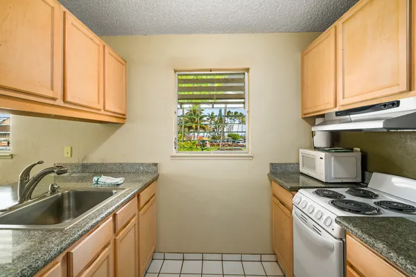 a kitchen that has a sink and a stove