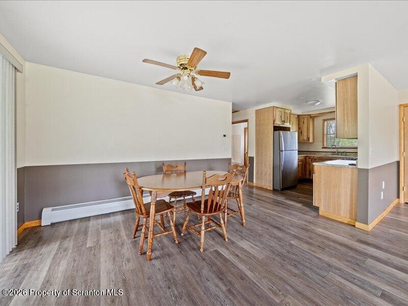 9-17 Vago Road Tunkhannock, PA 18657 - Photo 14 of 57 a view of a dining room with furniture and wooden floor