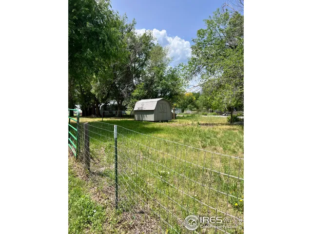 a view of a two chairs in the patio