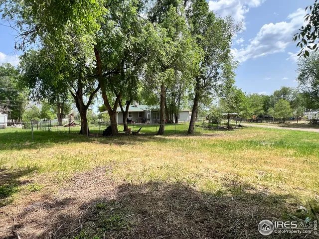 a view of a house with a yard porch and sitting area