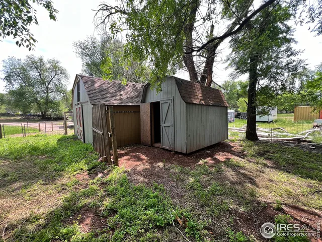a house that has a tree in front of it